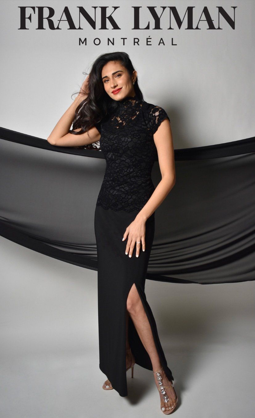 A Woman is Wearing a Black Dress — Onyx Poppy Boutique Buderim in Buderim, QLD