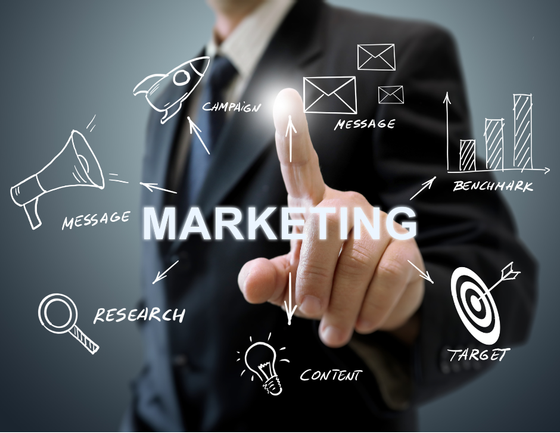 A man in a suit is pointing at a screen that says marketing