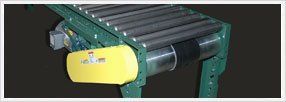 Flat Belt Driven Conveyors — Green Flat Belt Driven Conveyors In Shipping Area In Fort Worth, Tx
