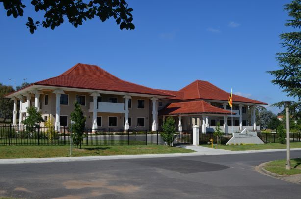 The Front Of A House With A Red Roof— Precast Concrete Solutions in Queanbeyan East, NSW