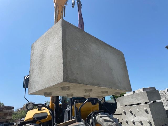 A Brick wall Along a Sidewalk next to a road — Precast Concrete Solutions in Queanbeyan East, NSW