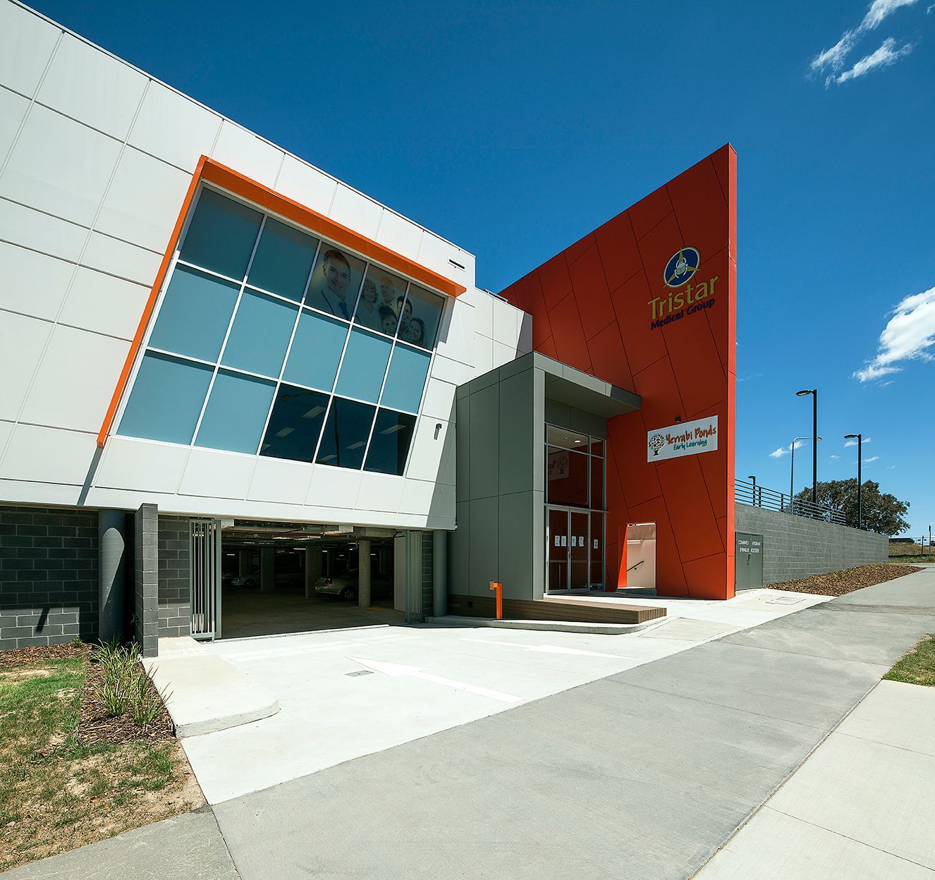A Building With Slanted Windows And Blue Sky — Precast Concrete Solutions in Queanbeyan East, NSW