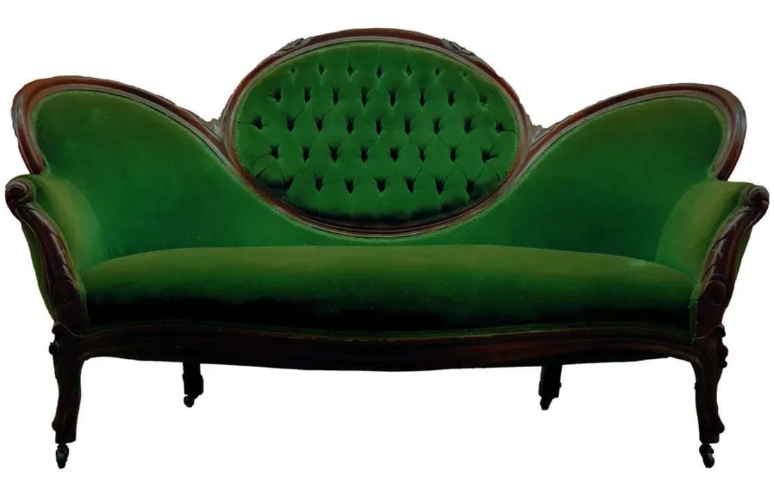 A green couch with a wooden frame on a white background