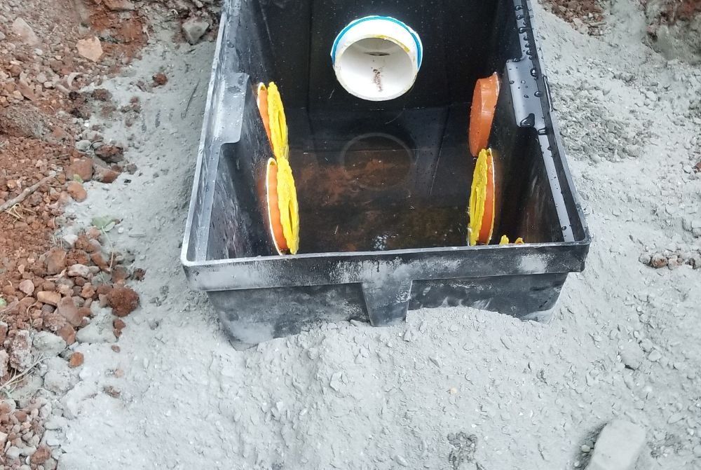 A black box with a white pipe inside of it