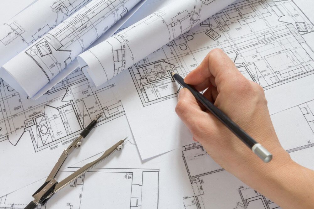 A Person Is Drawing A House Plan — D&C Projects in Tamworth, NSW