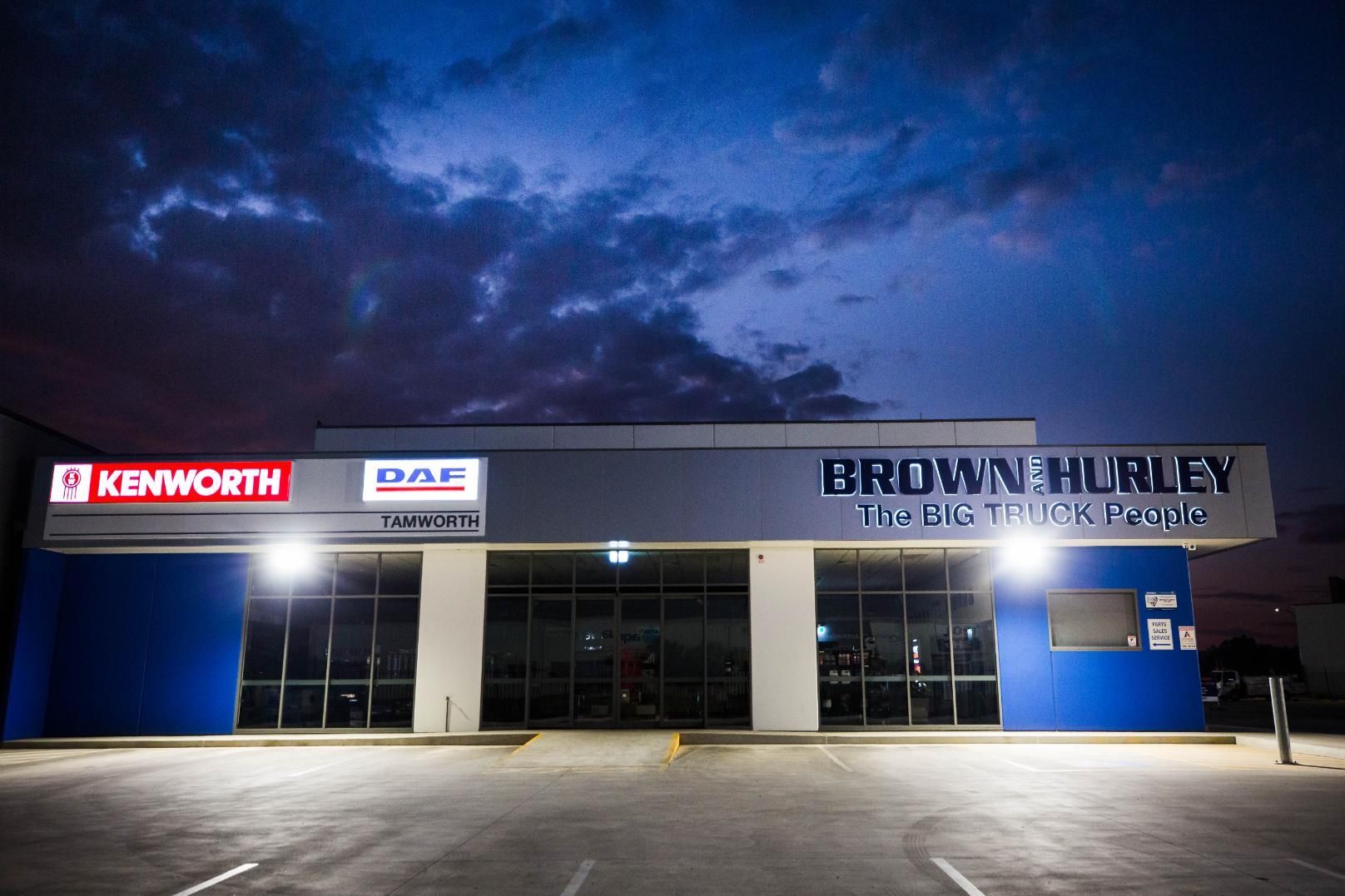 A Kenworth Truck Repair Shop Is Lit up At Night — D&C Projects in Tamworth, NSW