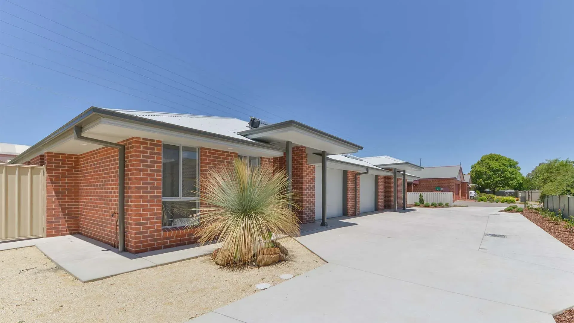 Charming Red Brick Residence Surrounded by Two Lush Green Trees — D&C Projects in Tamworth, NSW