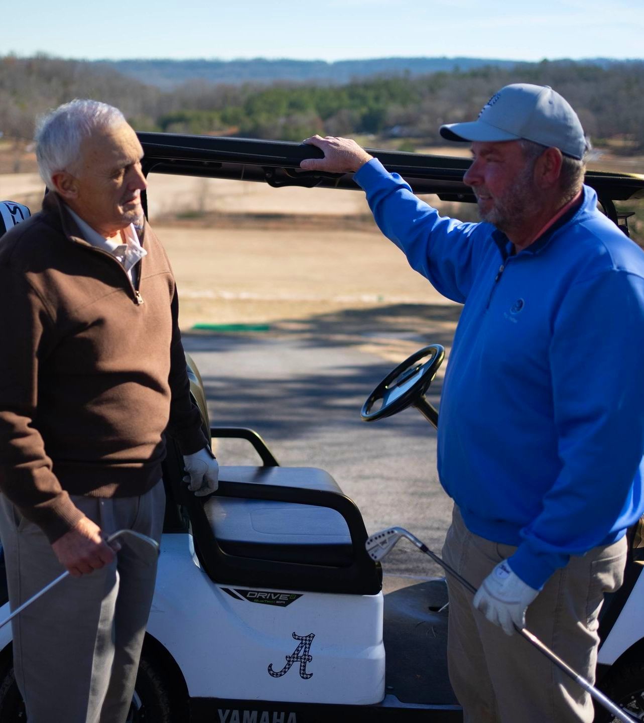 Golfers at talking at Trenton Golf Club in Trenton Georgia