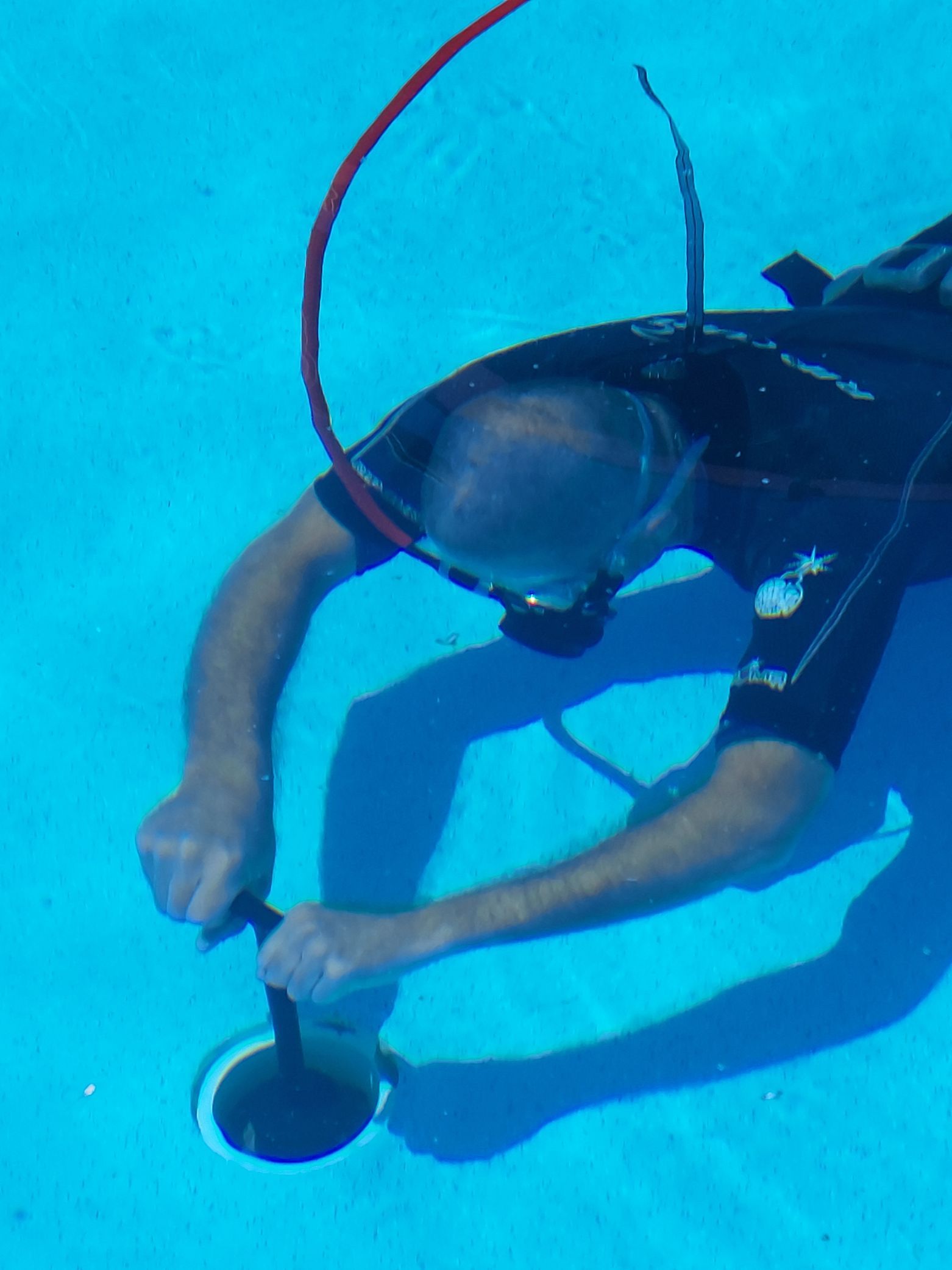 Man With Equipment Under The Water — Leak Detection & Swimming Pool Repairs in Ballina, NSW