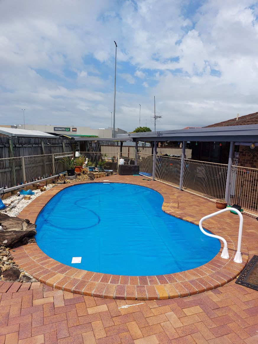 Pool With Cover In The Backyard — Leak Detection & Swimming Pool Repairs in Ballina, NSW