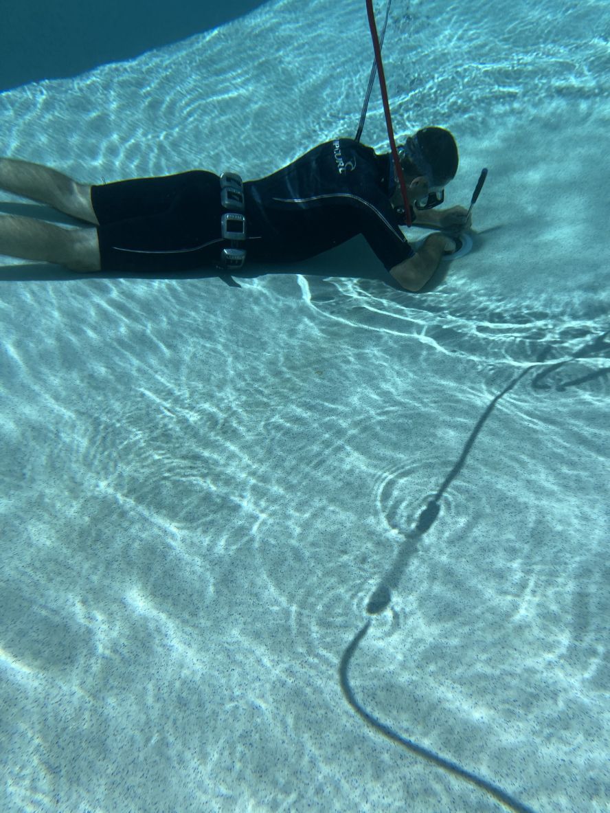 Man Using Tool To Fix Leak — Leak Detection & Swimming Pool Repairs in Ballina, NSW