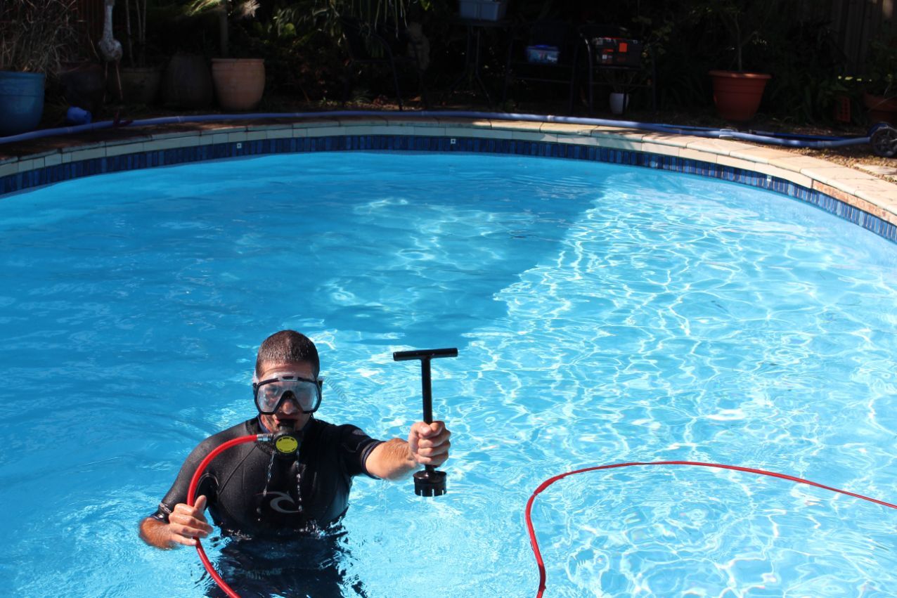 Man Holding A Tool — Leak Detection & Swimming Pool Repairs in Ballina, NSW