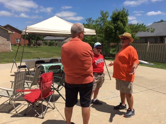 A man in an orange shirt with the word texas on it
