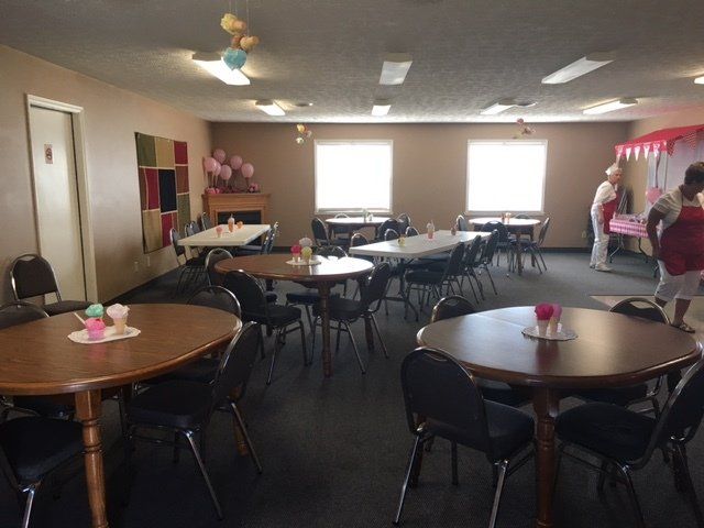 A large room filled with tables and chairs