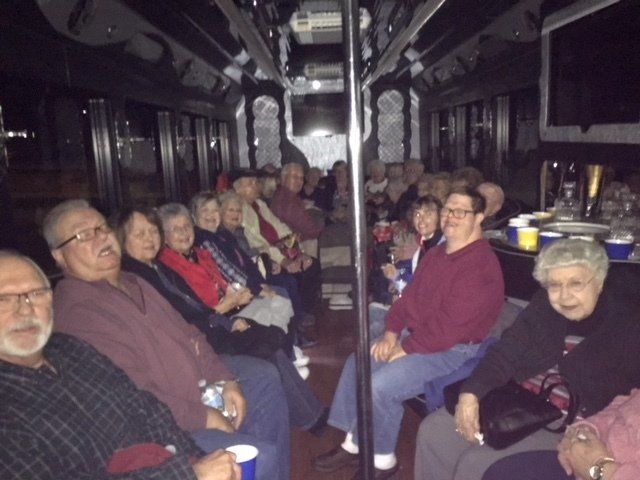 A group of people are sitting on a bus