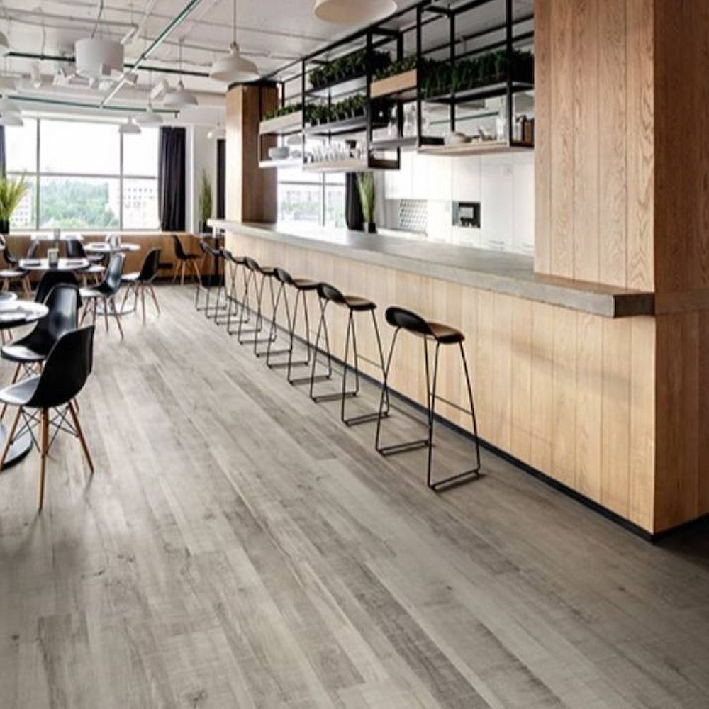 Modern Office Kitchen With Light Wood Floor, and a Long Bar With Stools — AGM Flooring & Tiling in Hidden Valley, QLD