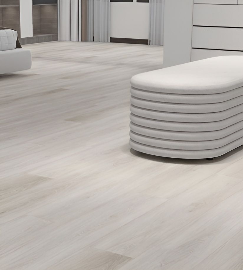 Light-toned Hardwood Floor in a Minimalist Bedroom, With a White Bench — AGM Flooring & Tiling in Hidden Valley, QLD