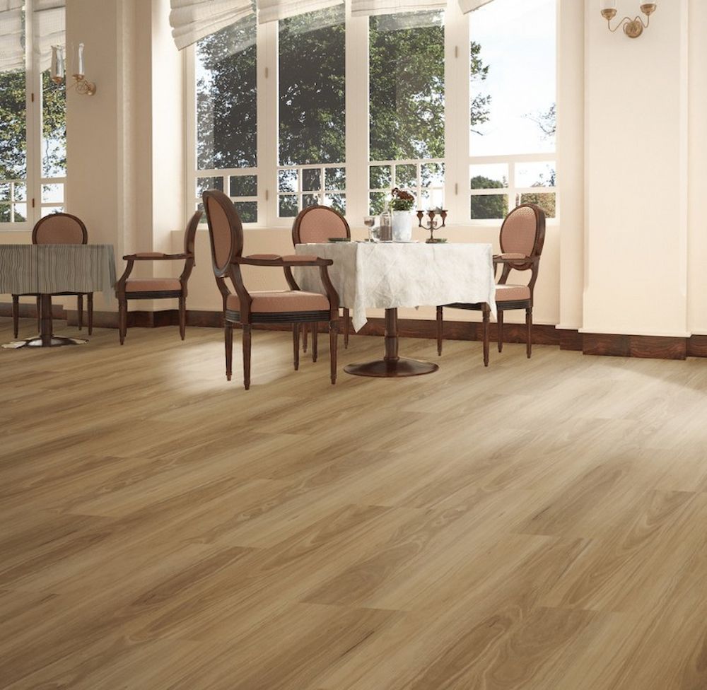 A Room With Light Wood Flooring and a Round Table Set for Dining — AGM Flooring & Tiling in Hidden Valley, QLD