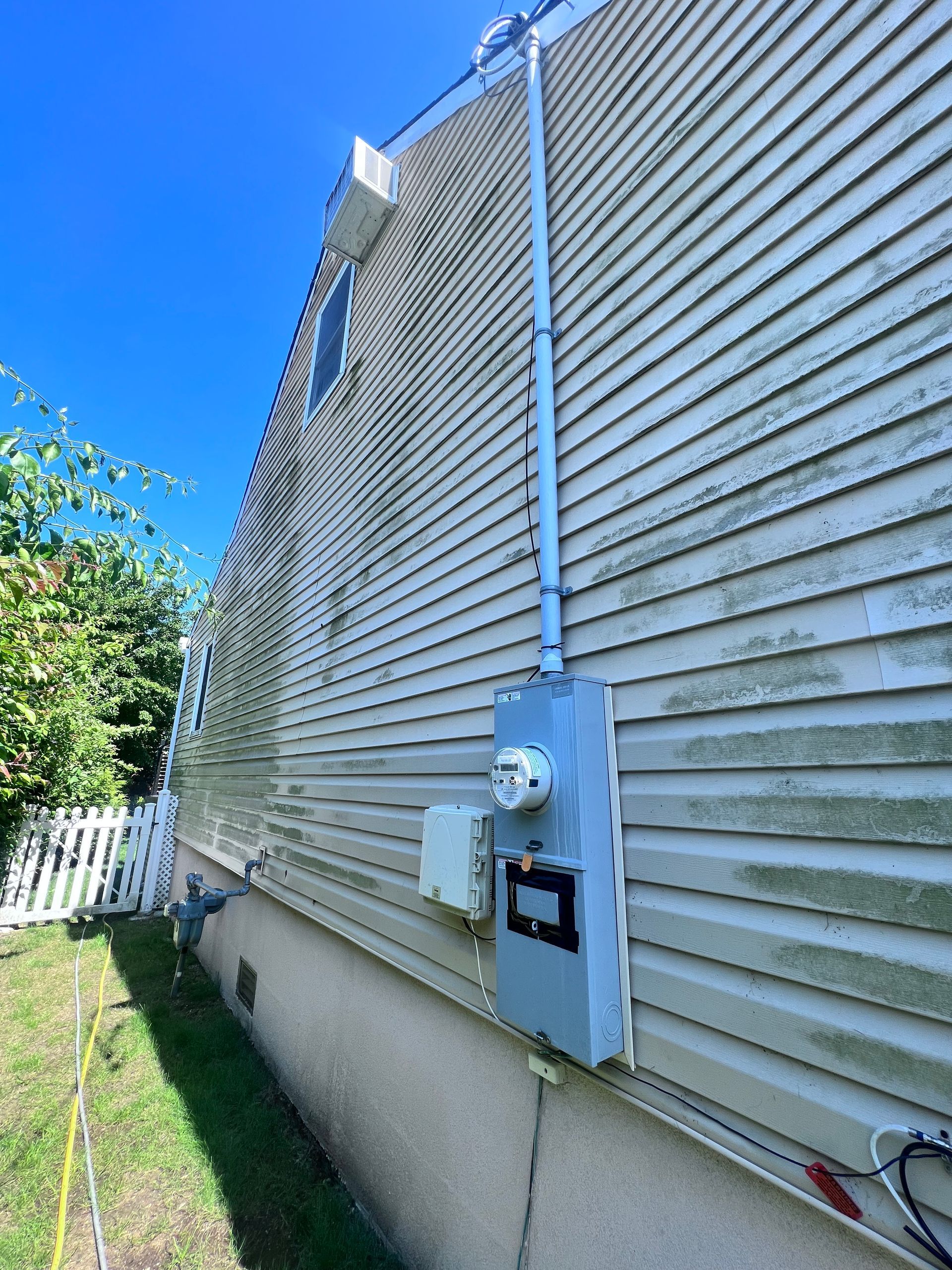 Image showing vinyl siding with mildew growth, highlighting the need for cleaning and maintenance.