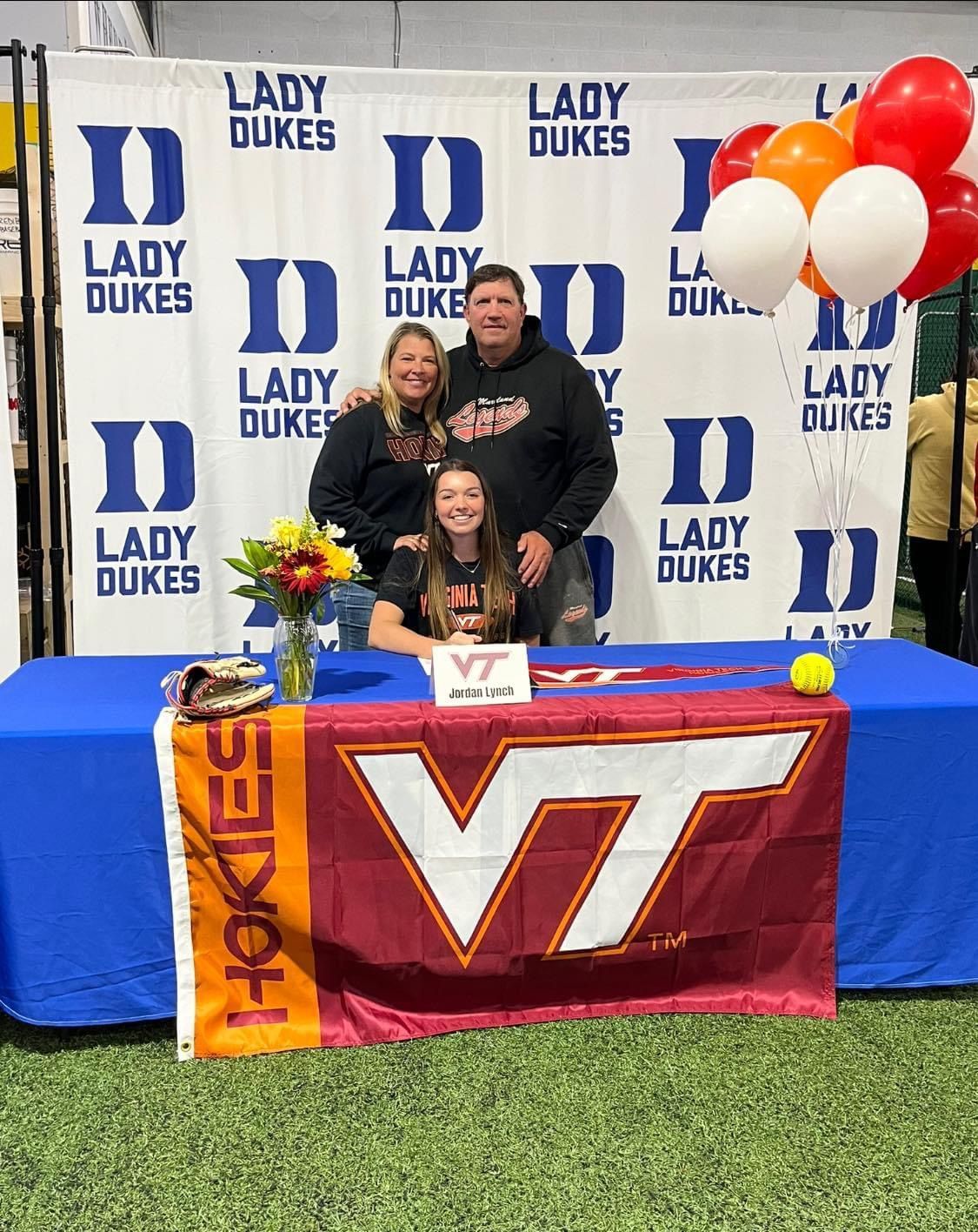 A girl is signing a letter of intent for the Lady Dukes — Elkton, MD — Maryland Legends Baseball