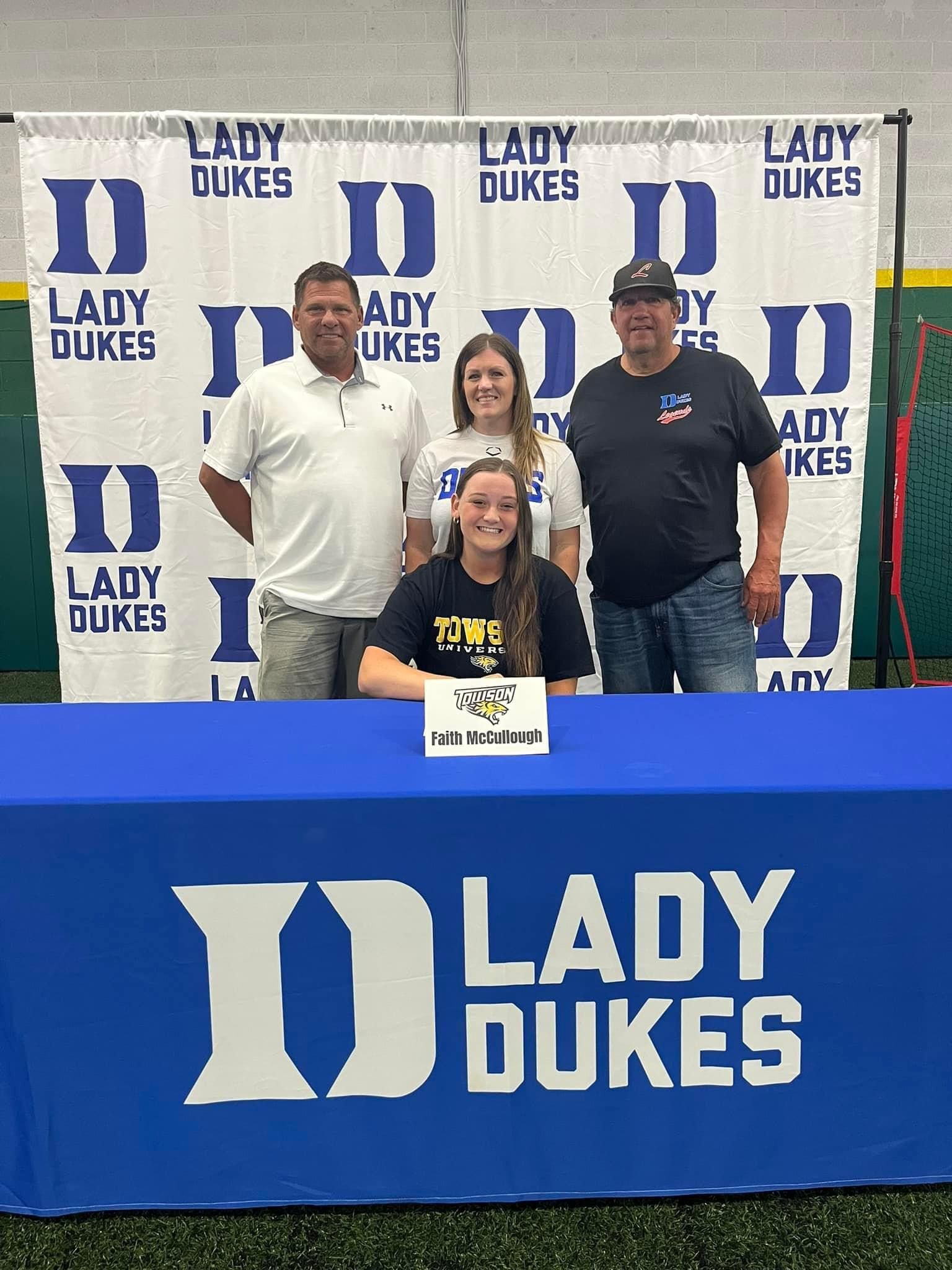 A girl is signing a letter of intent for the Lady Dukes — Elkton, MD — Maryland Legends Baseball
