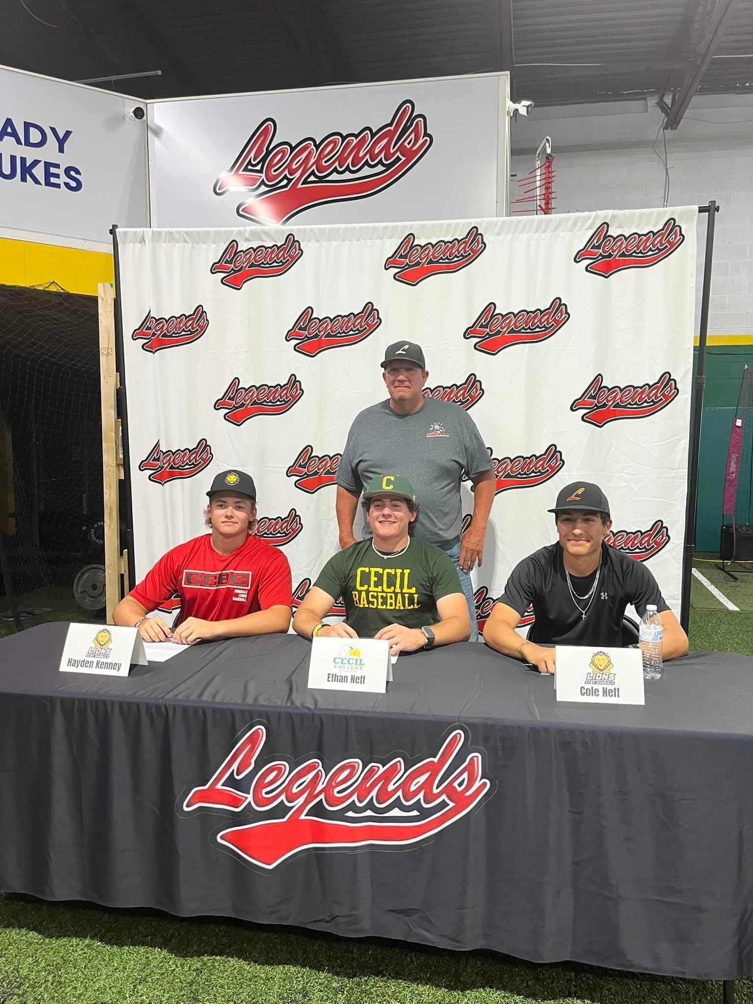 A group of baseball players are sitting at a table signing autographs — Elkton, MD — Maryland Legends Baseball