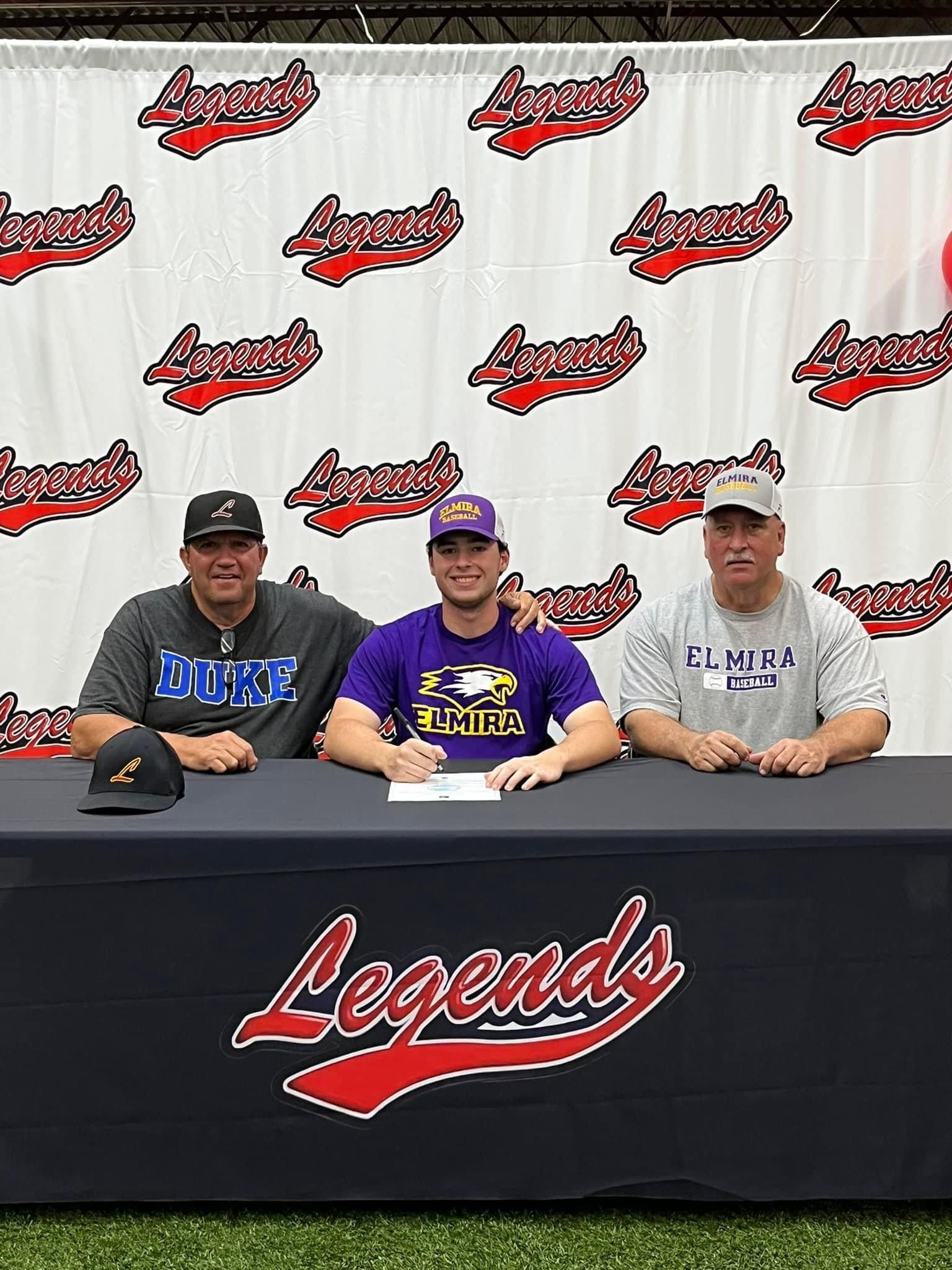 Three men are sitting at a table signing a baseball contract — Elkton, MD — Maryland Legends Baseball