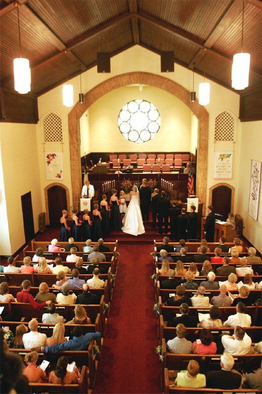 A bride and groom are getting married in a church