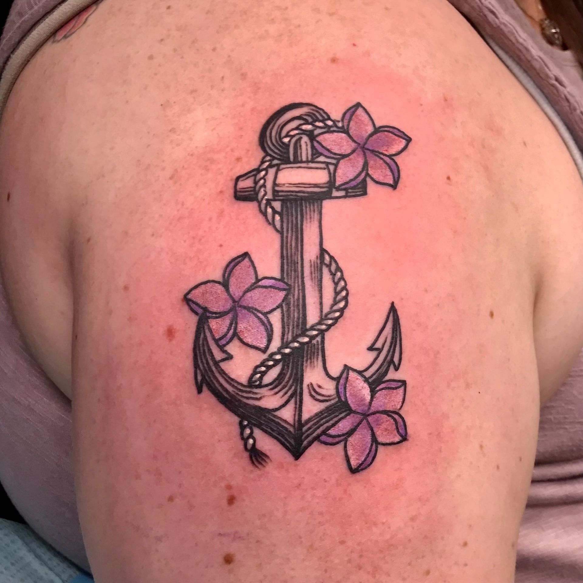 Anchor with flowers tattoo 