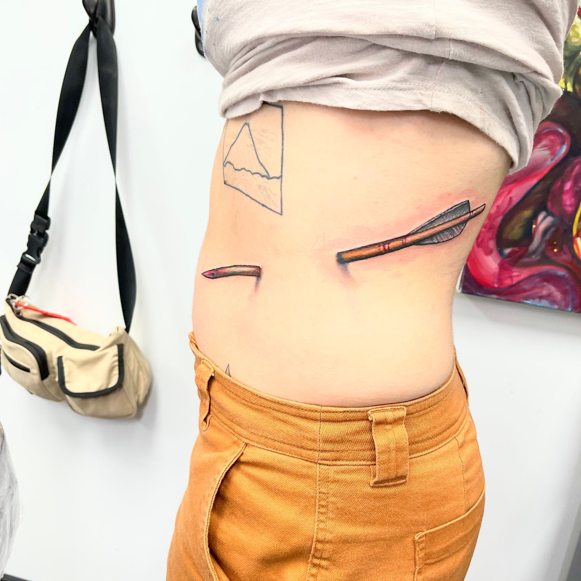 Arrow Through Side Tattoo