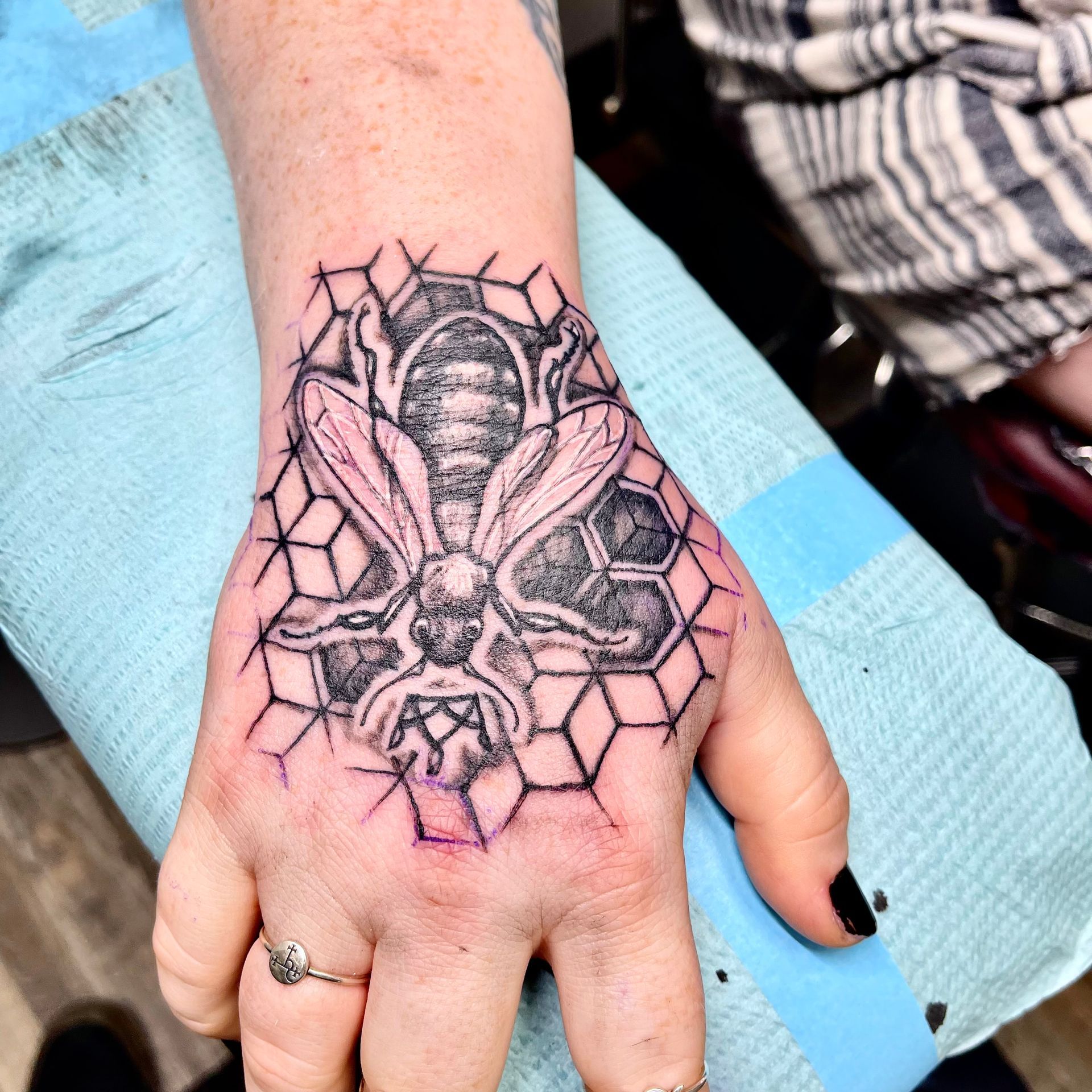 Honeybee and comb tattoo