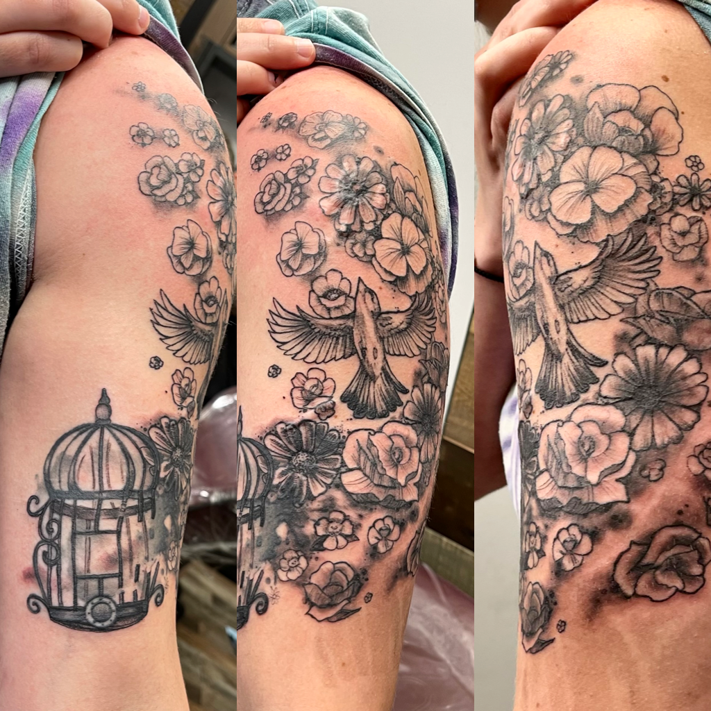 Birdcage with bird and flowers tattoo 