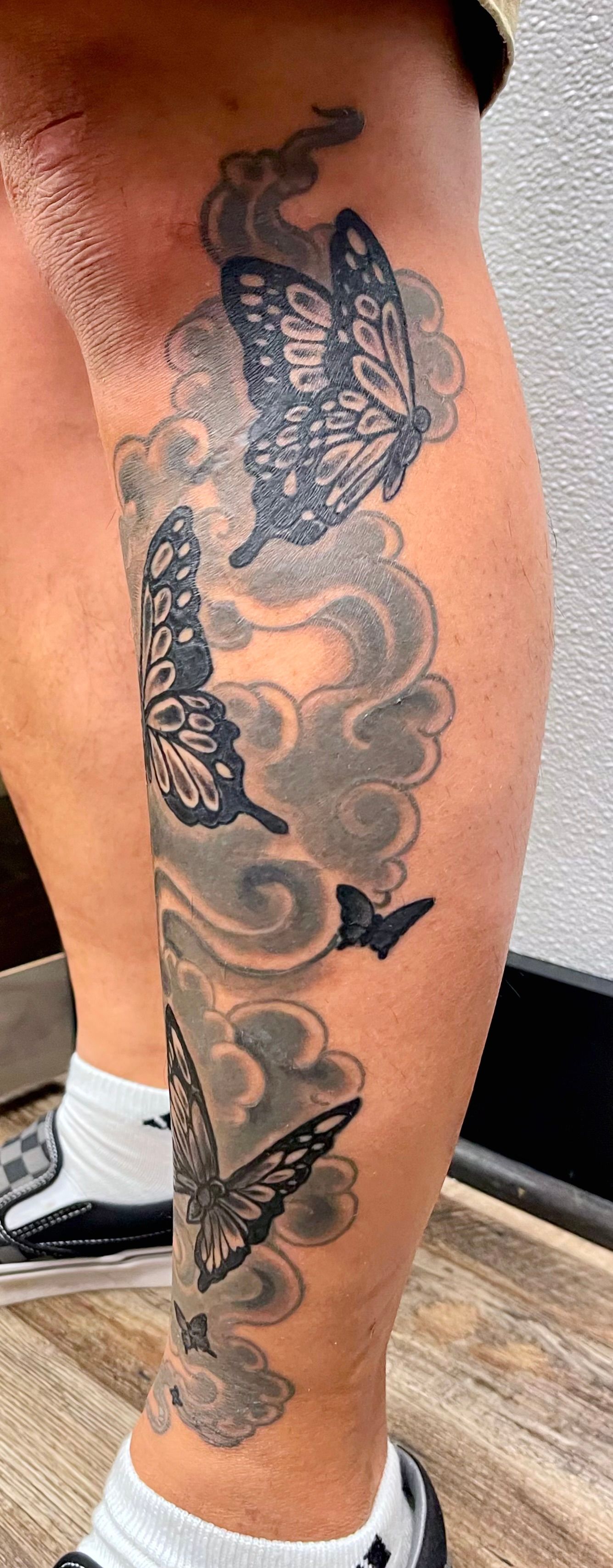 Butterflies and clouds tattoo
