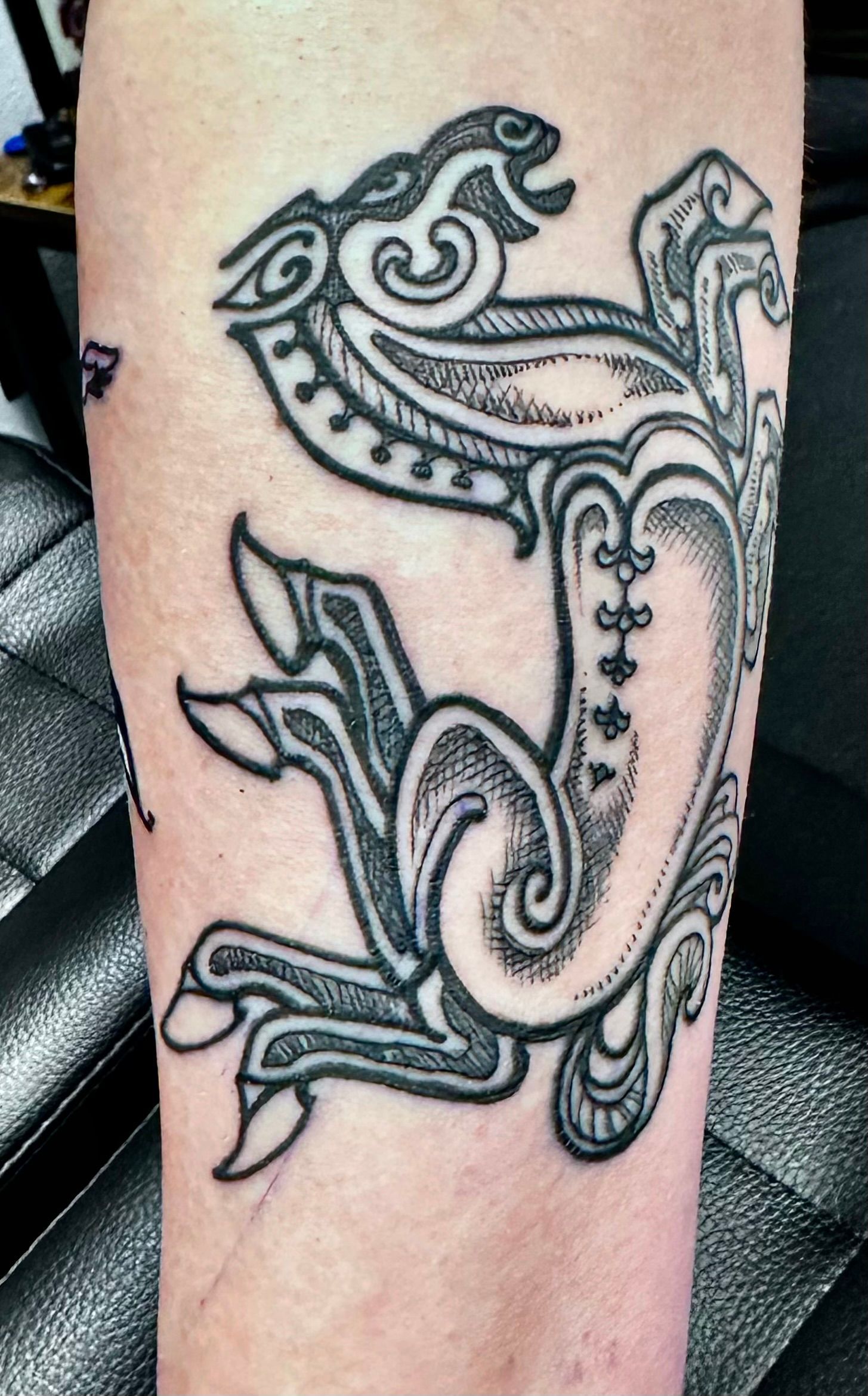 Cave painting with 8-legged horse tattoo