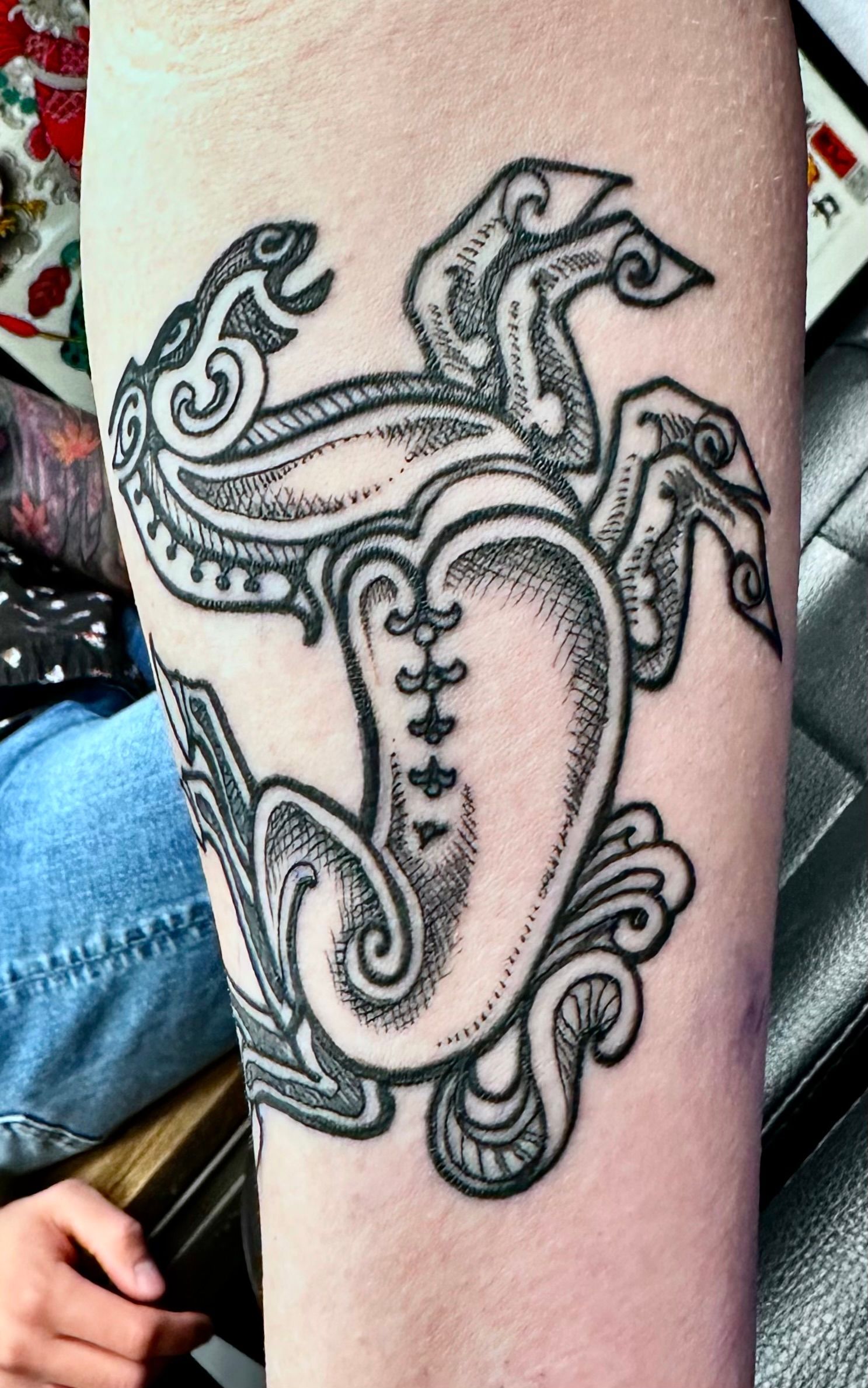 Cave painting with horse tattoo