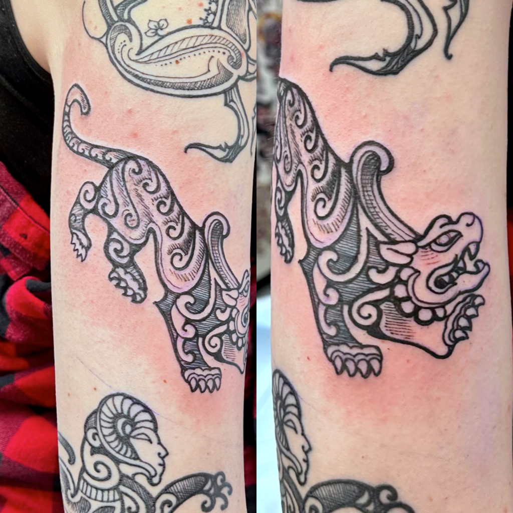 Cave painting with tiger tattoo