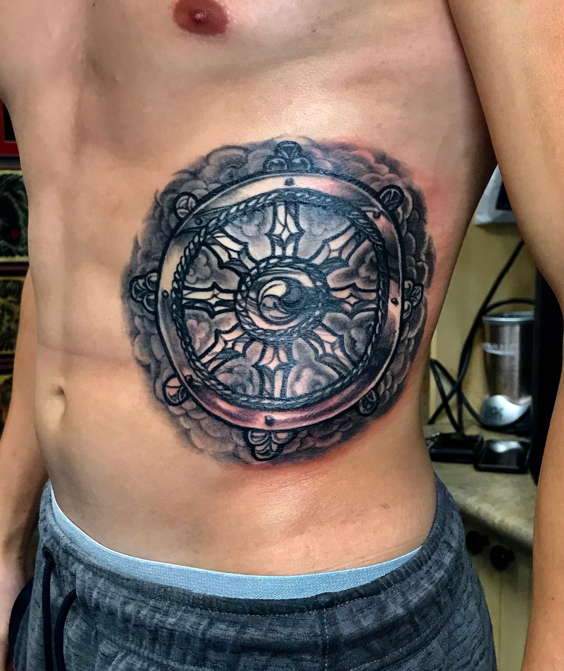 Large Dharma wheel tattoo