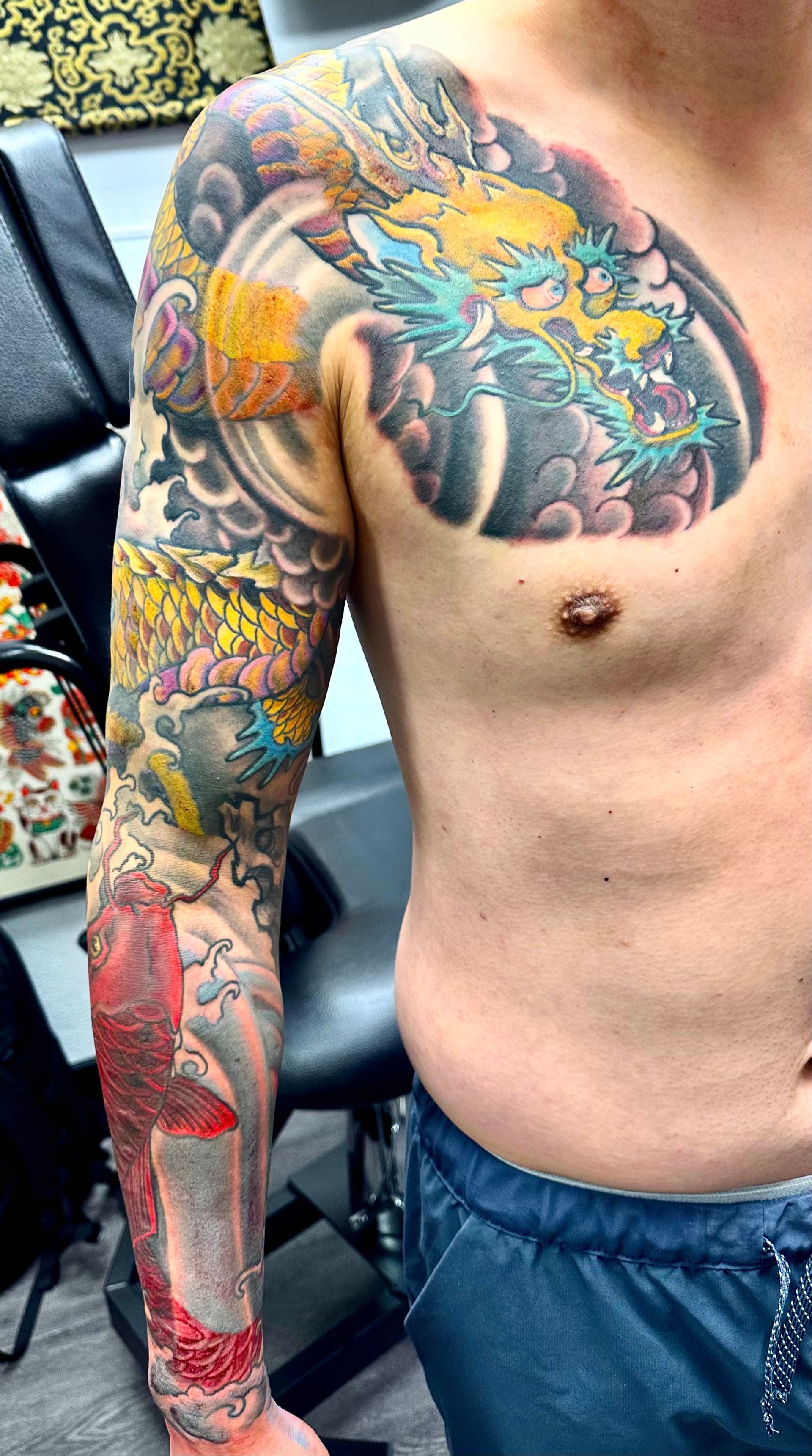 Golden dragon in waves tattoo