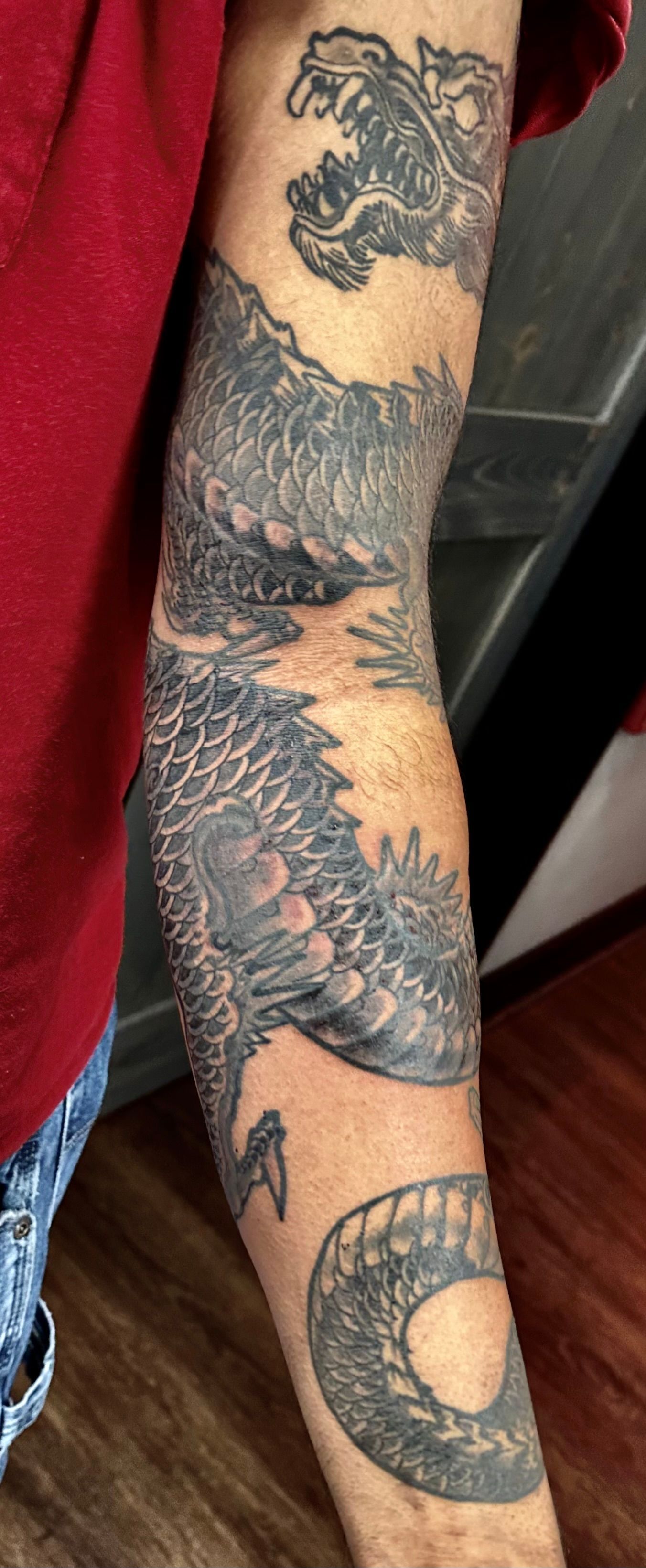 Dragon with hairy head tattoo