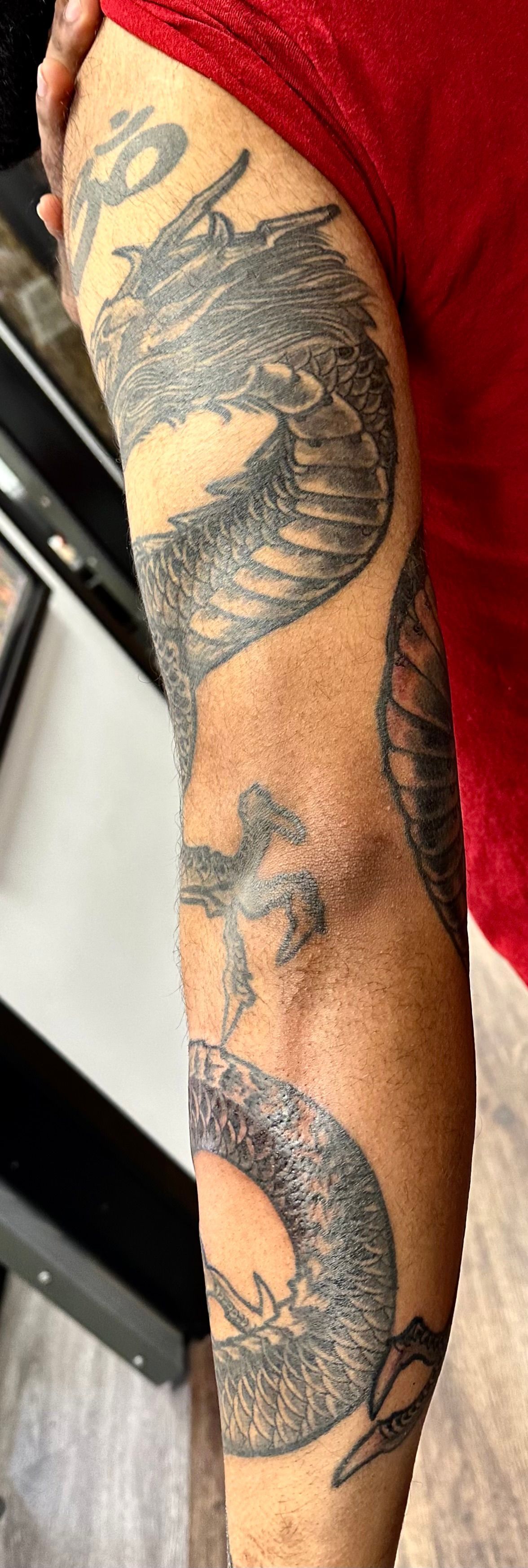 Dragon with hairy head tattoo