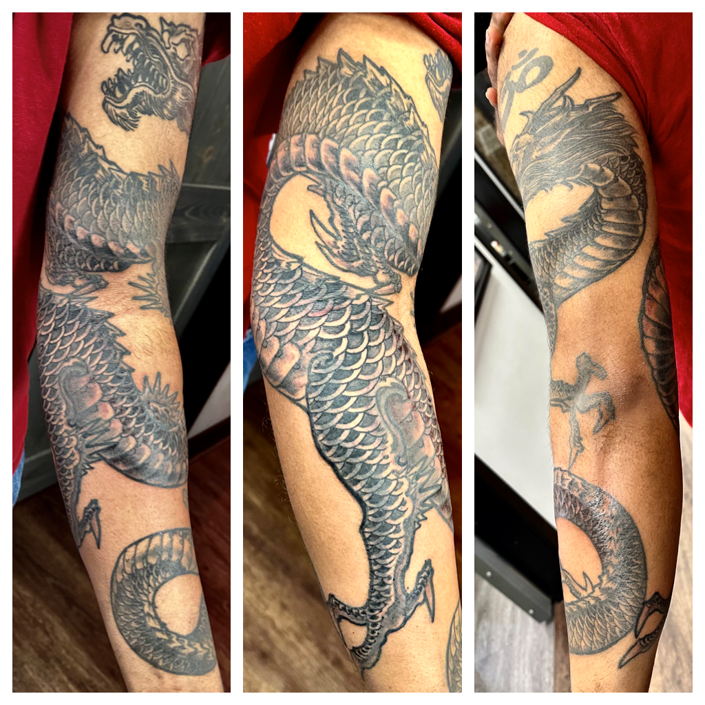 Dragon with hairy head full arm tattoo