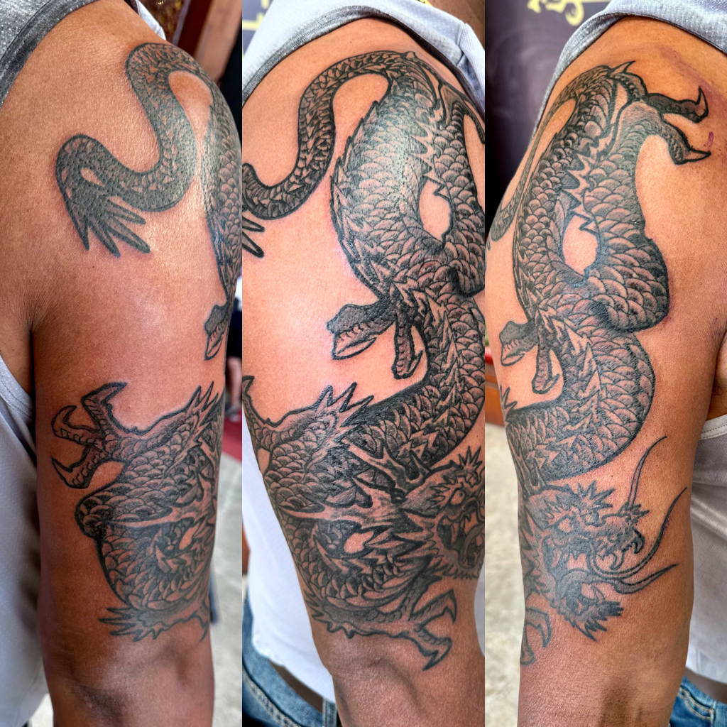 Dragon in Nepal sleeve tattoo