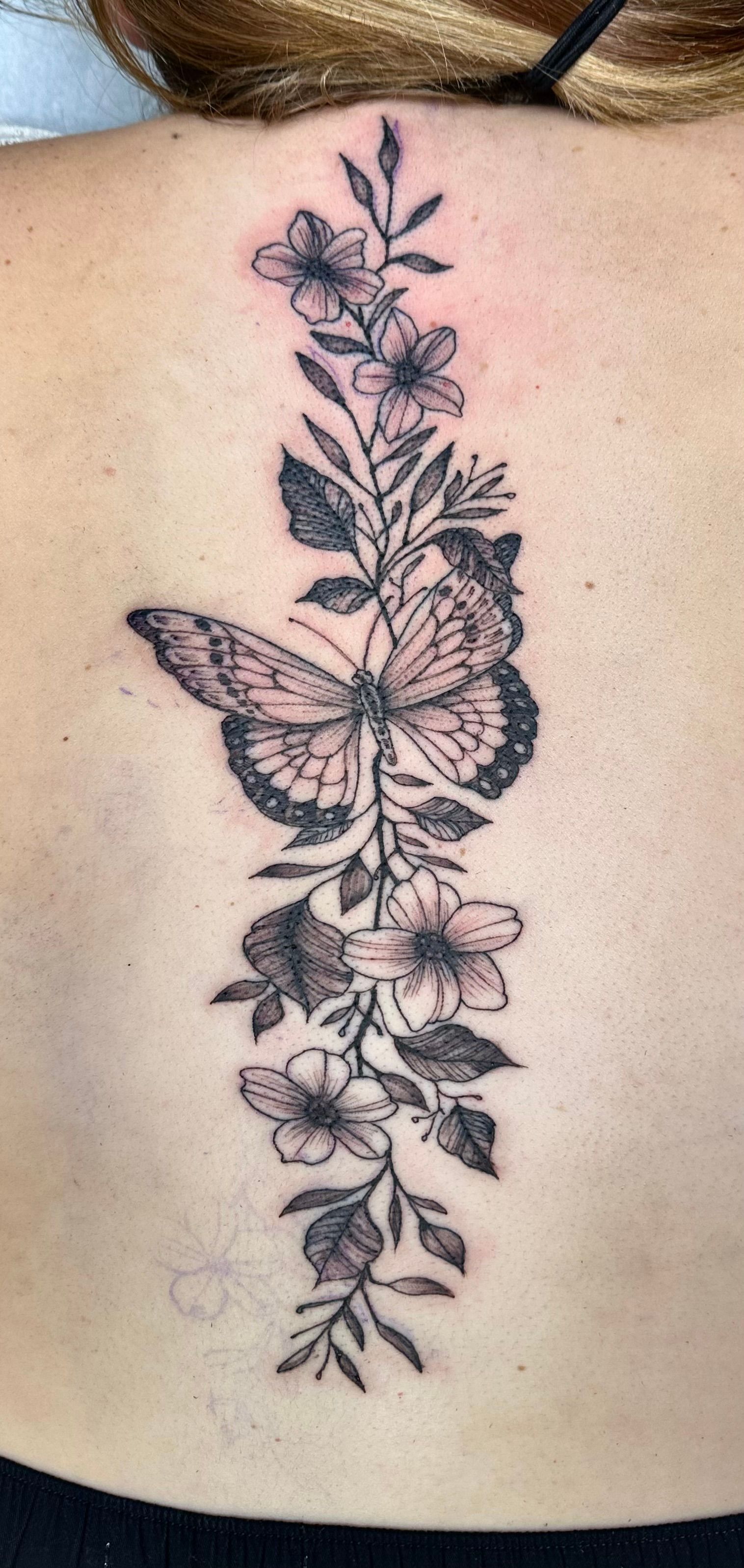 Flowers and butterfly tattoo