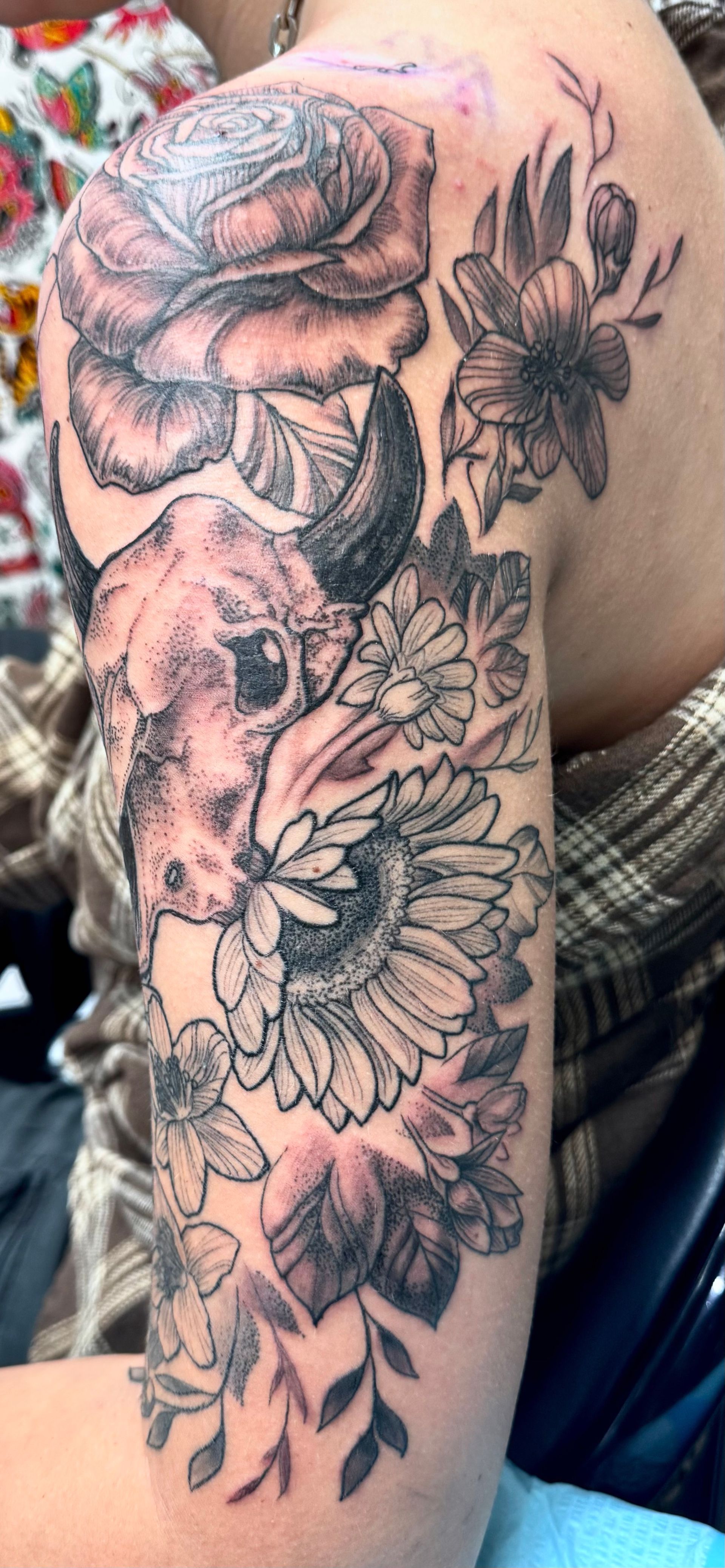 Flowers and cow skull tattoo