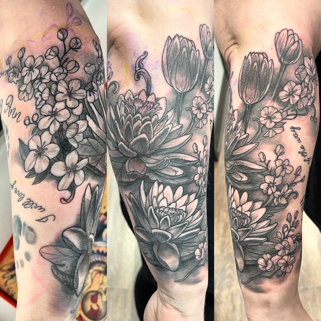Flowers tattoo in black and gray