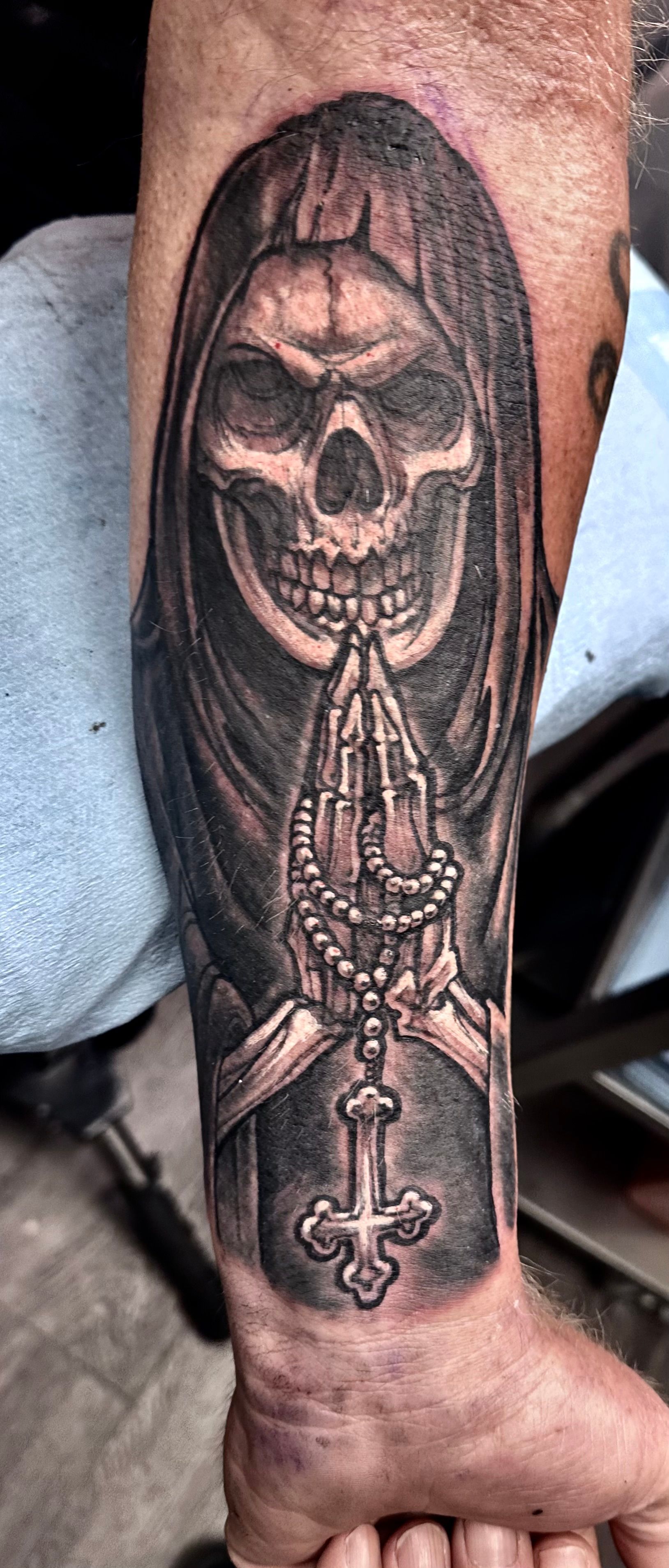 Grim Reaper with rosary tattoo
