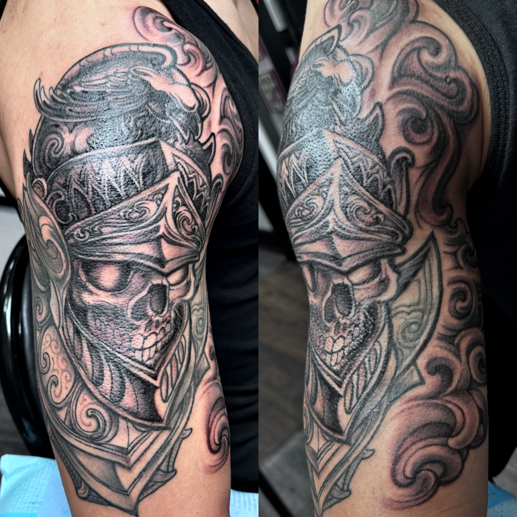 Helmet on skull tattoo