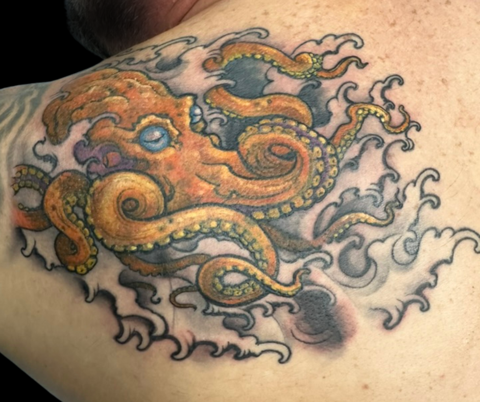 cool octopus tattoo on back of shoulder