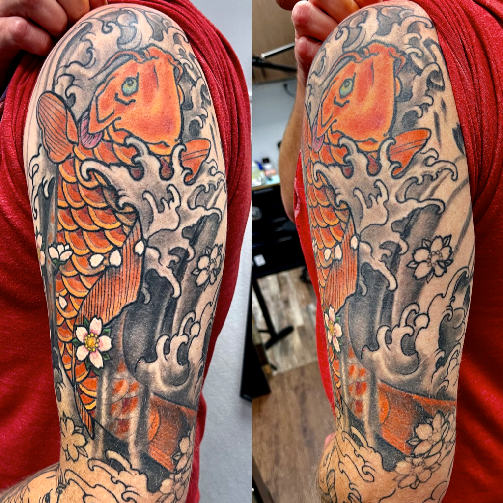 Orange koi with white blossoms tattoo
