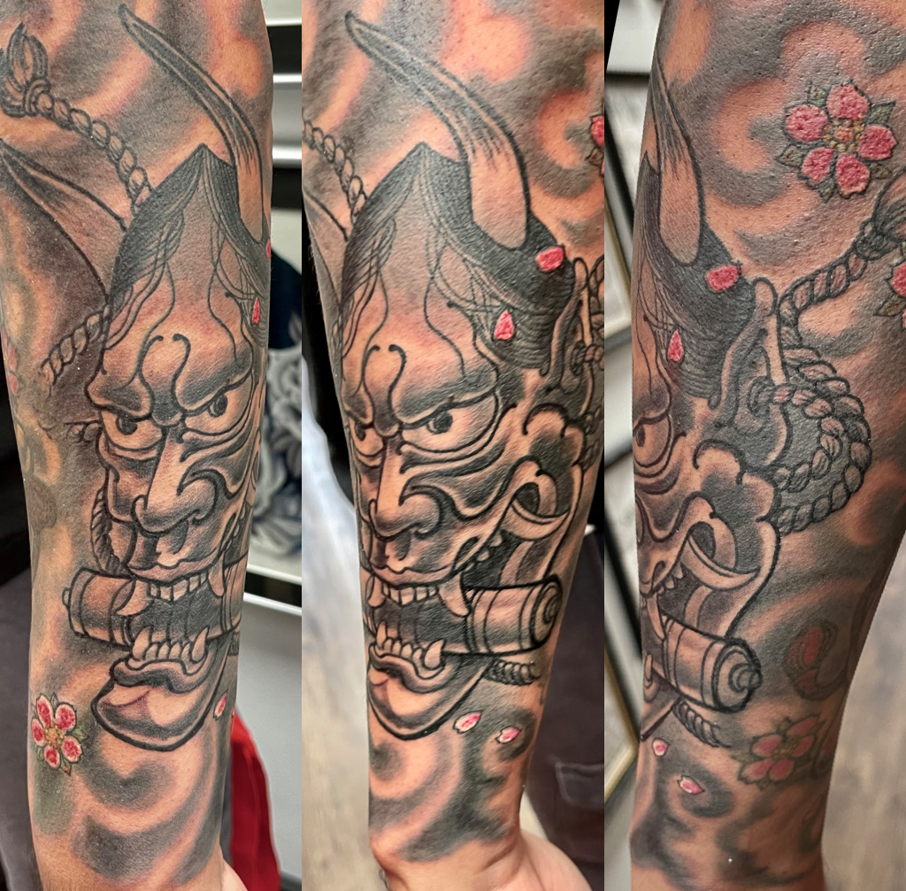 Oni with scroll and blossoms tattoo
